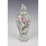 A Chinese Canton famille rose porcelain vase and cover, late 19th century, the baluster body painted