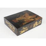 A Chinese Canton export lacquer games box, early to mid-19th century, of rectangular form, the
