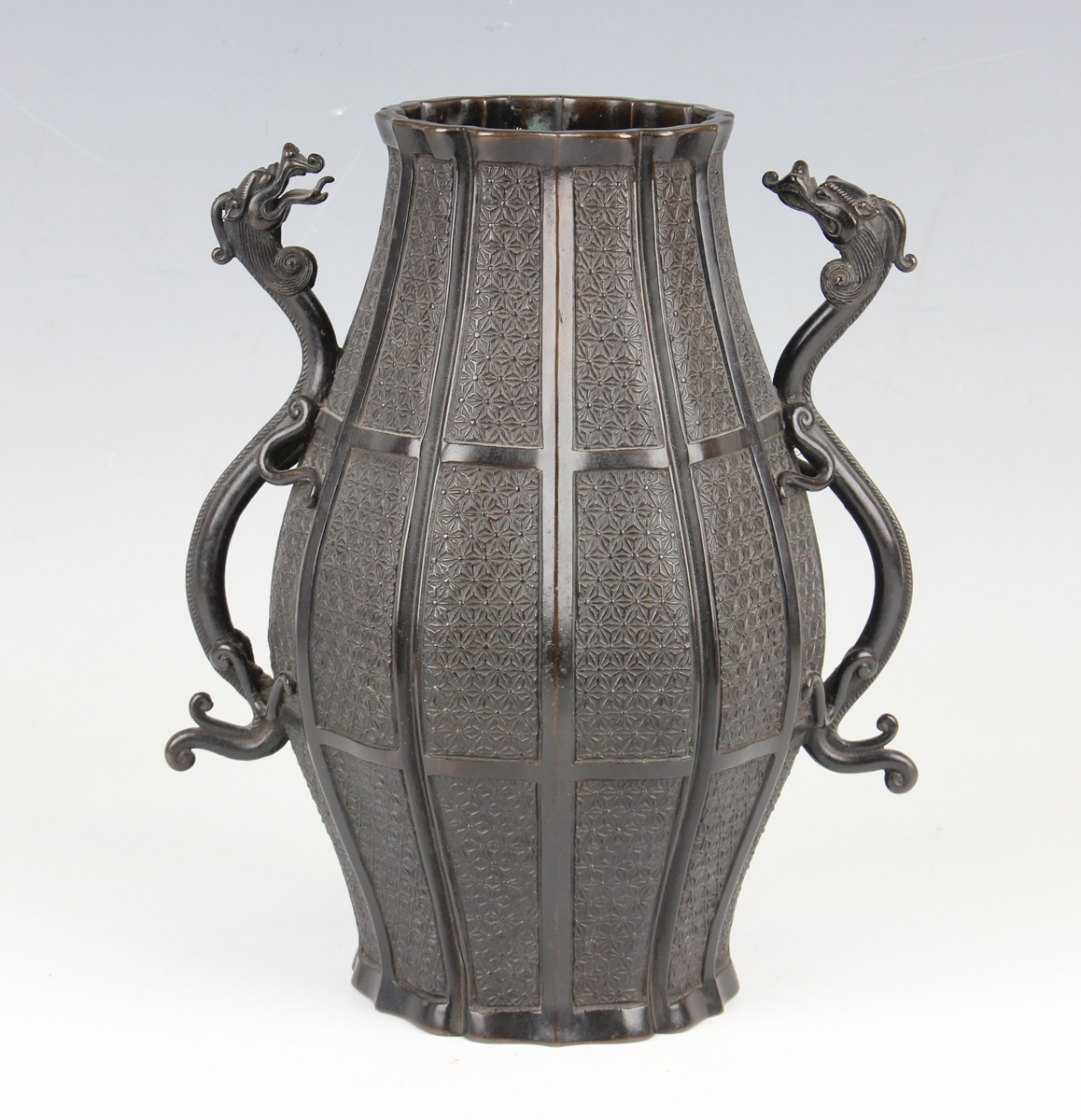 A Japanese brown patinated bronze two-handled vase, 19th century, in the Chinese style, of