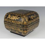 A Chinese lacquer box and cover, late Qing dynasty, of compressed square form, the top decorated
