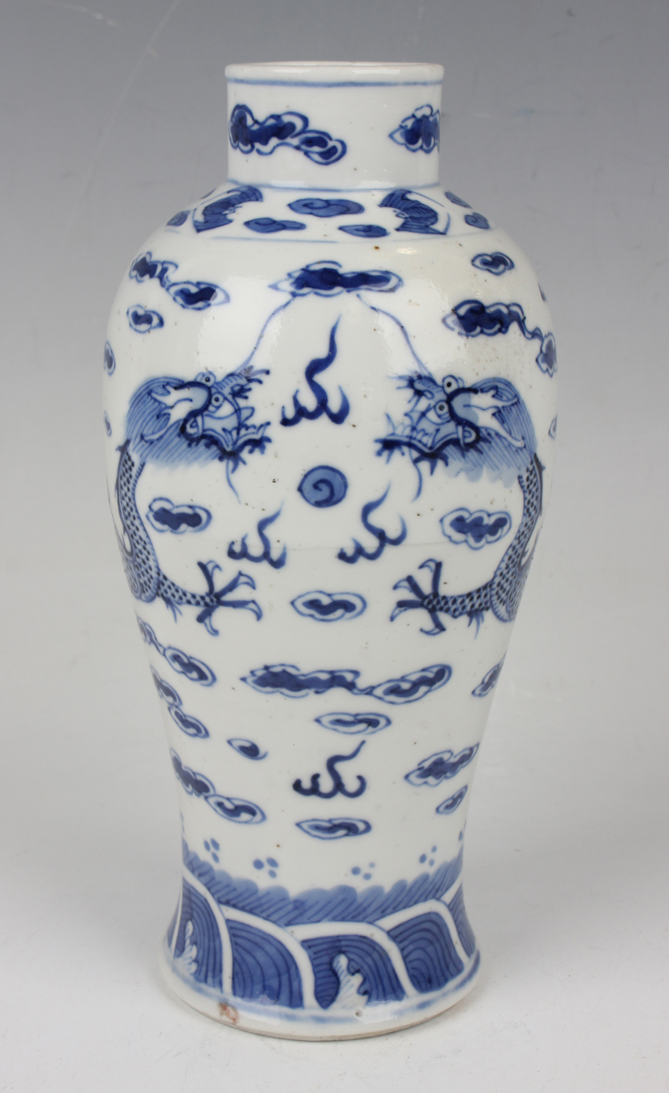A Chinese blue and white porcelain vase, mark of Kangxi but late 19th century, the baluster body
