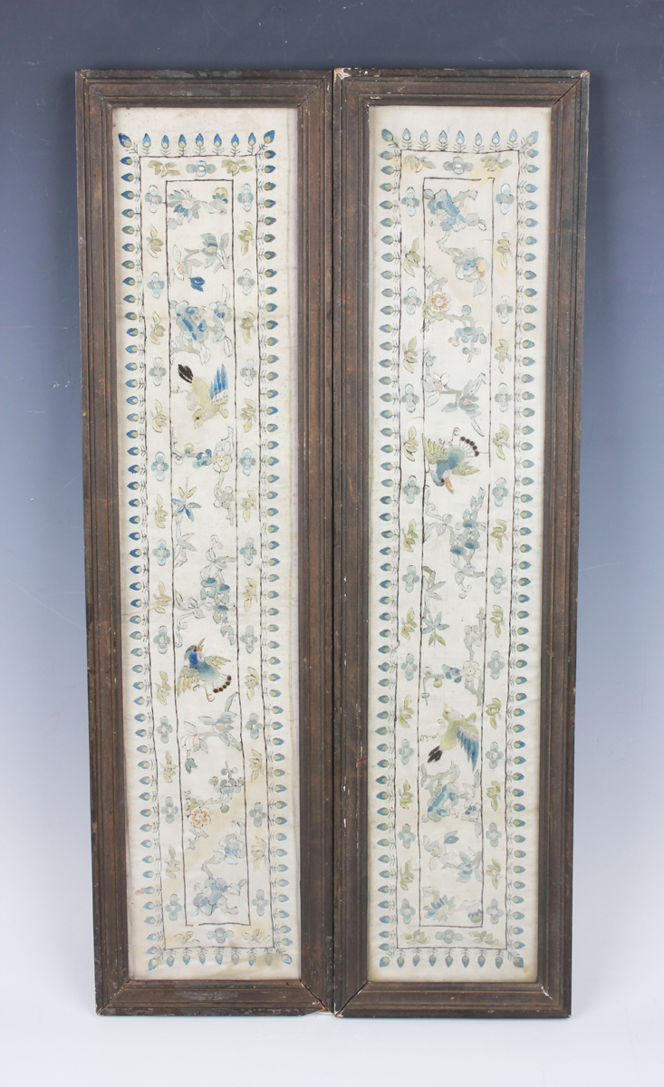 A pair of Chinese silk embroidered rectangular sleeve panels, late Qing dynasty, each worked in
