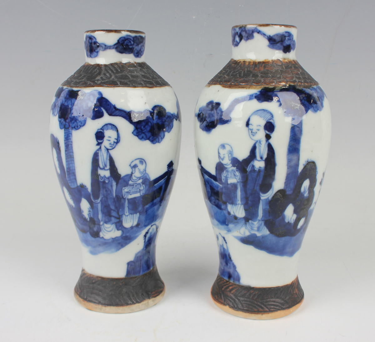 A pair of Chinese blue and white porcelain vases, late 19th/early 20th century, each baluster body