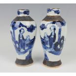 A pair of Chinese blue and white porcelain vases, late 19th/early 20th century, each baluster body