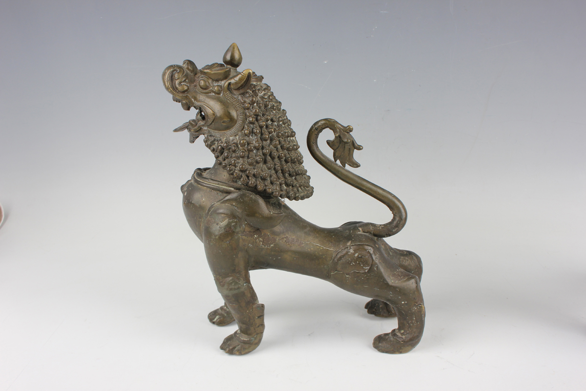 A pair of South-east Asian bronze models of Buddhistic lions, probably Nepalese, late 19th - Image 11 of 13