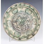 A South-east Asian cream glazed circular dish, probably Burmese (Myanmar), 15th century, painted
