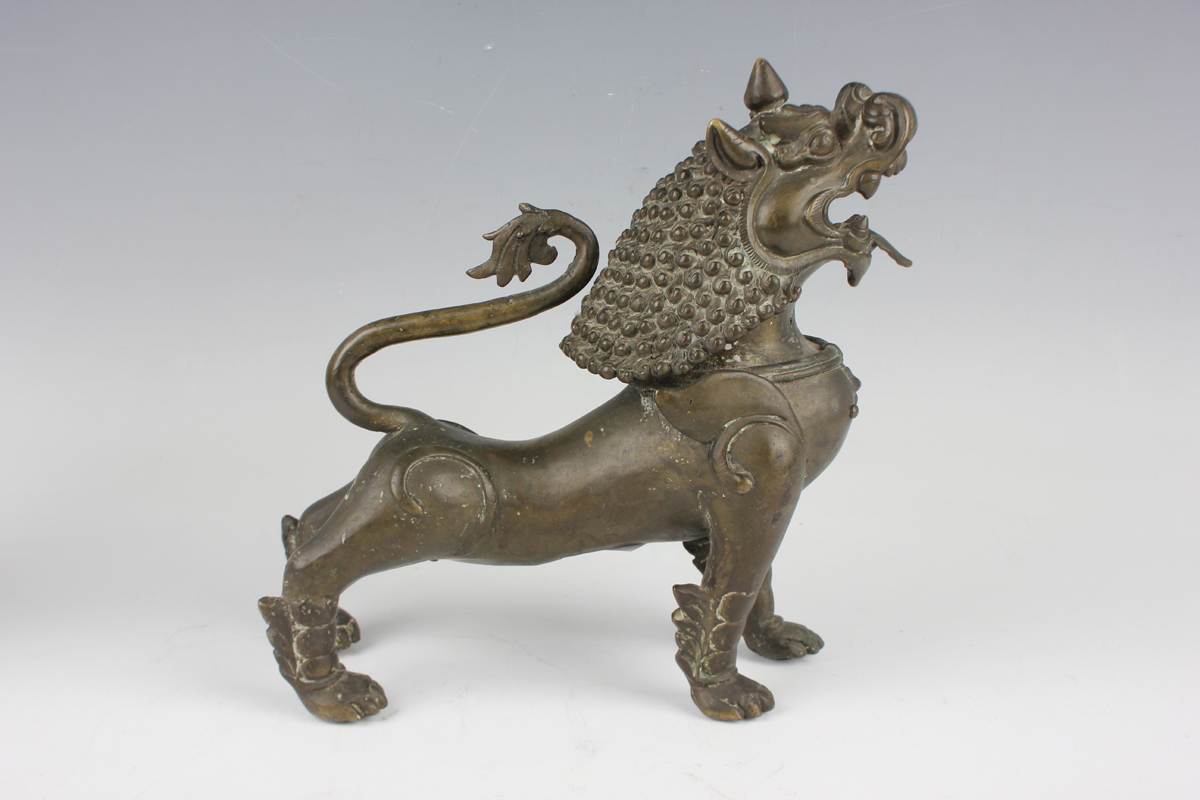 A pair of South-east Asian bronze models of Buddhistic lions, probably Nepalese, late 19th - Image 6 of 13