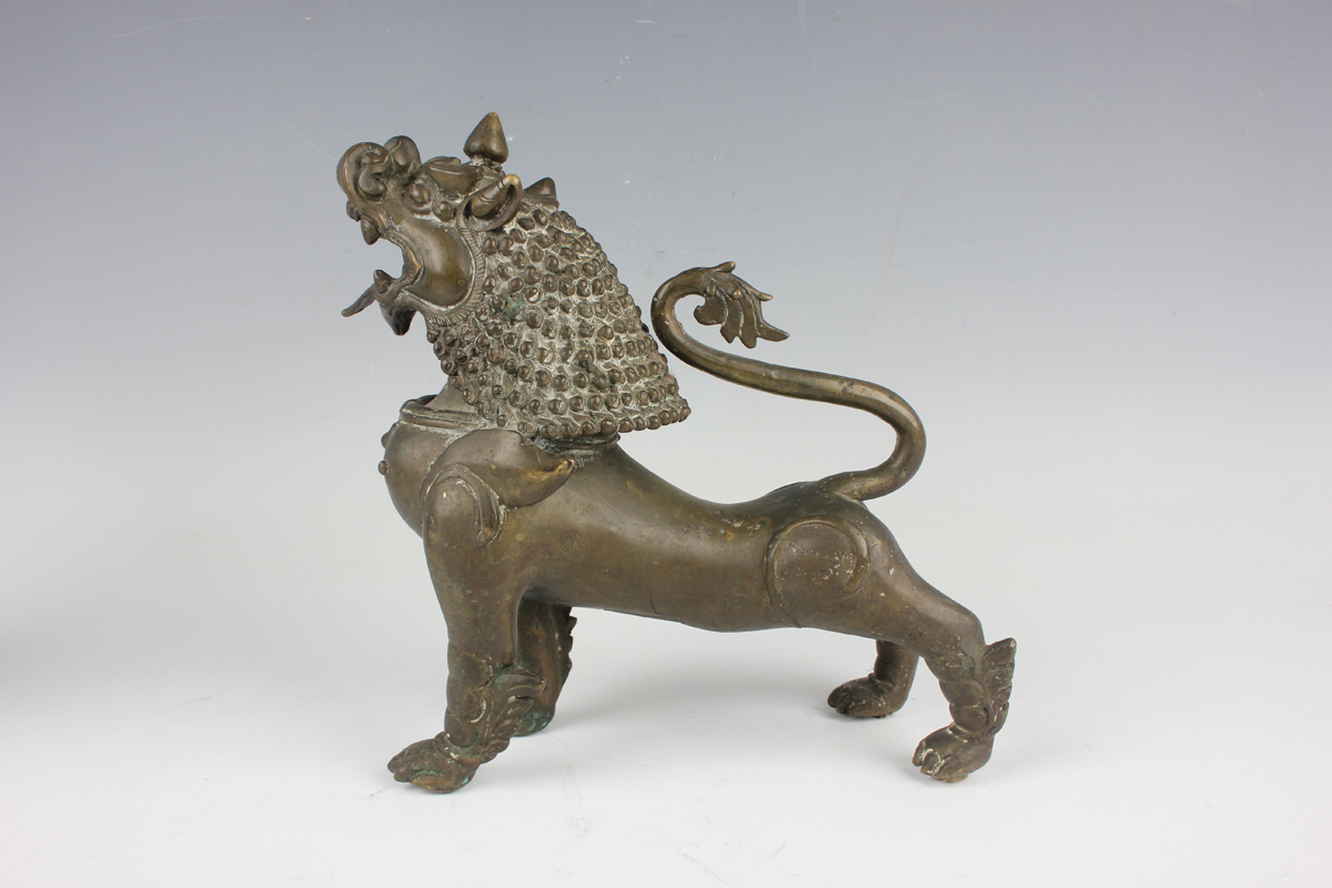 A pair of South-east Asian bronze models of Buddhistic lions, probably Nepalese, late 19th - Image 8 of 13