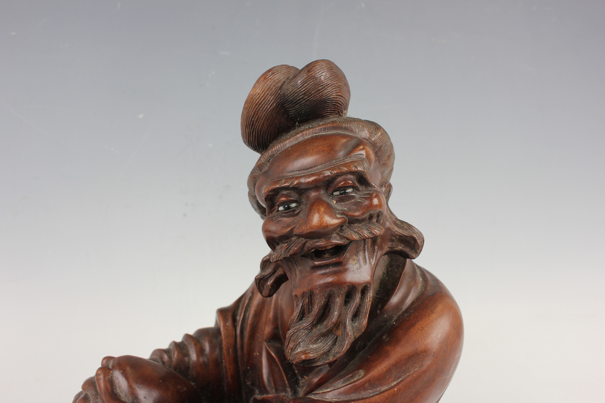 A Chinese hardwood figure of an elderly gentleman, early 20th century, modelled in a seated pose, - Image 14 of 15