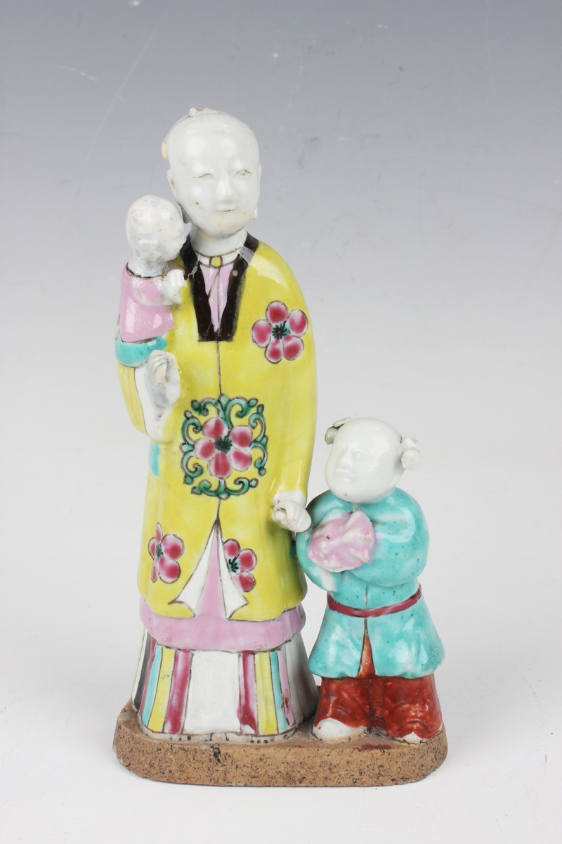 A Chinese famille rose enamelled biscuit porcelain figure group, 18th century, modelled as a