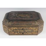 A Chinese Canton lacquer workbox, early 19th century, of canted corner form with brass handles to