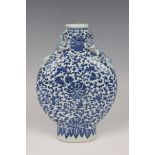 A Chinese blue and white porcelain moonflask, late 19th century, the flattened circular body painted