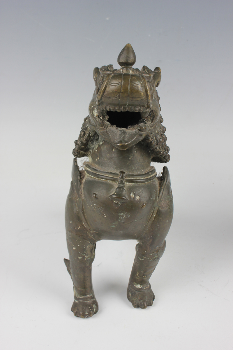 A pair of South-east Asian bronze models of Buddhistic lions, probably Nepalese, late 19th - Image 12 of 13