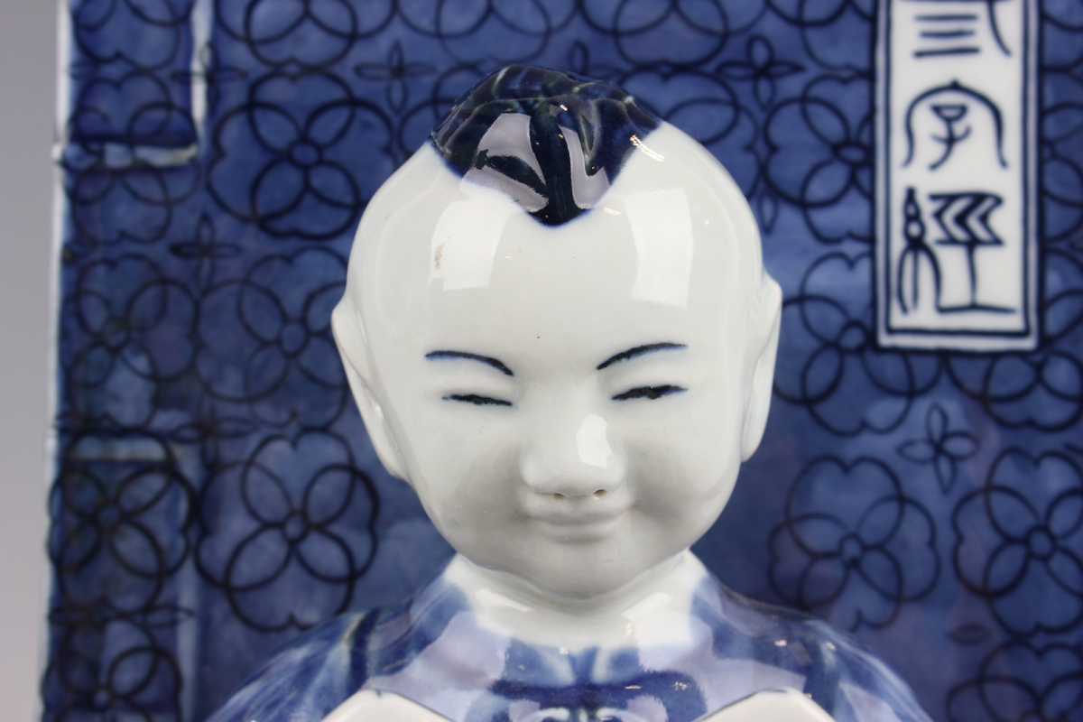 A pair of Chinese blue and white porcelain bookends, each modelled with a seated boy or girl reading - Image 10 of 18