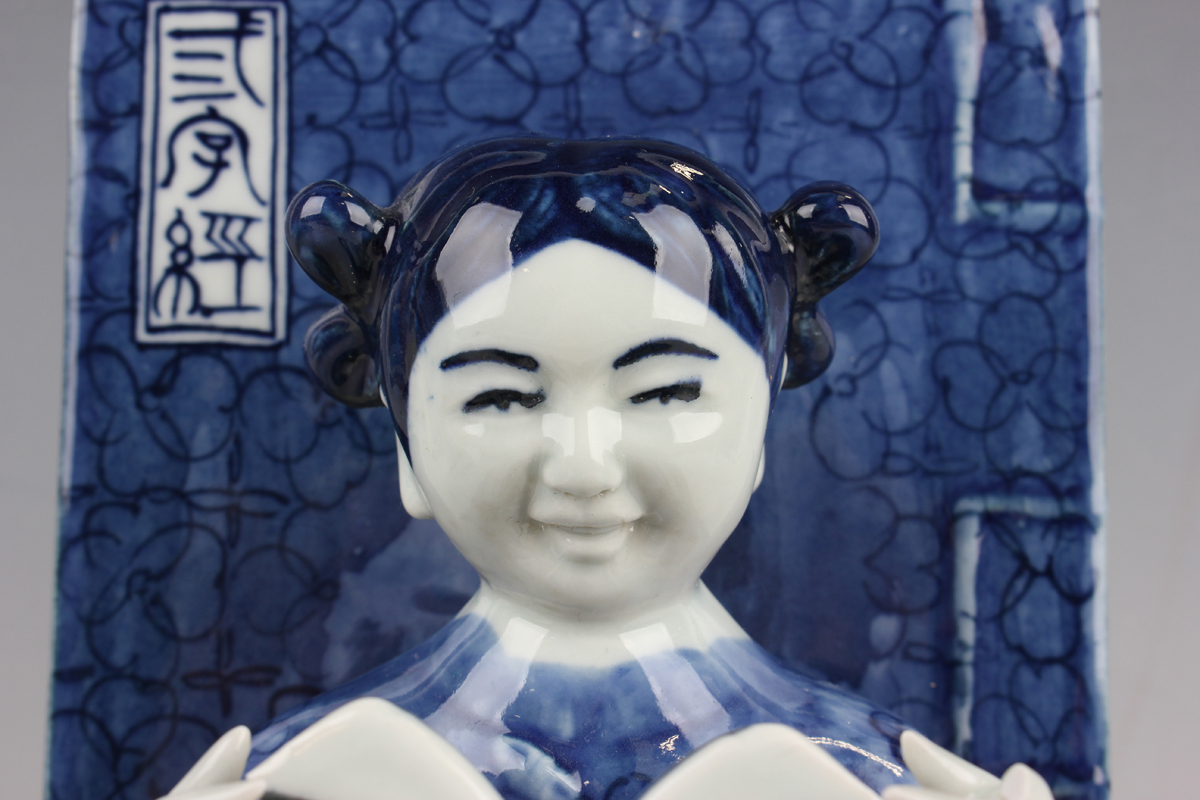 A pair of Chinese blue and white porcelain bookends, each modelled with a seated boy or girl reading - Image 17 of 18