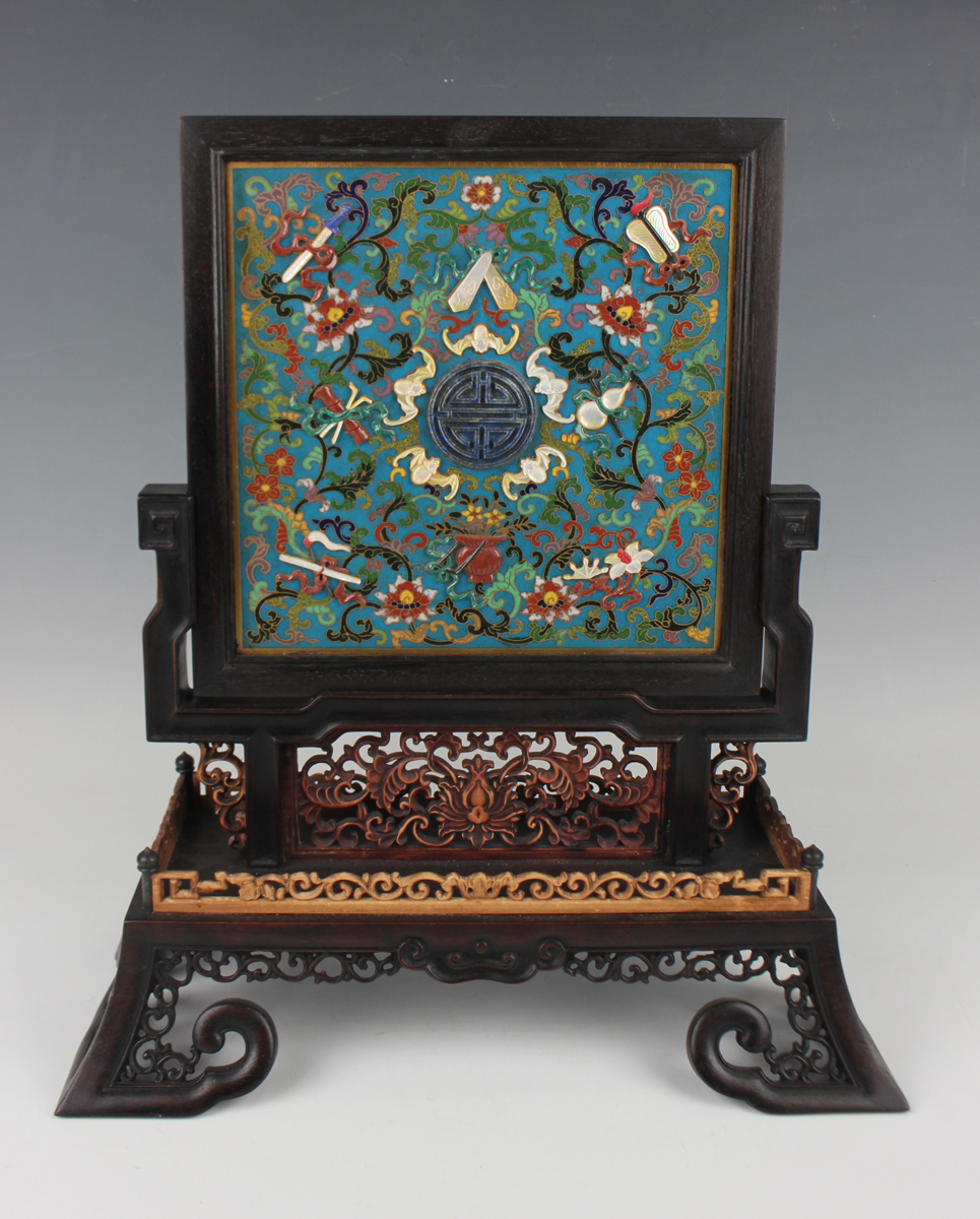 A Chinese hardwood framed cloisonné and lacquer table screen with carved hardwood and boxwood