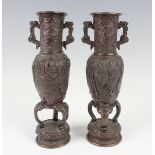 A pair of Japanese brown patinated bronze vases, Meiji/Taisho period, each cast with birds and pine,