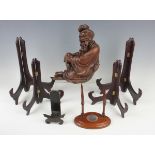 A Chinese hardwood figure of an elderly gentleman, early 20th century, modelled in a seated pose,