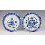 A near pair of Chinese Canton blue and white export porcelain plates, mid-19th century, each painted