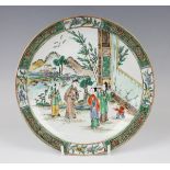 A Chinese Canton famille verte porcelain circular dish, late 19th century, painted with a figural