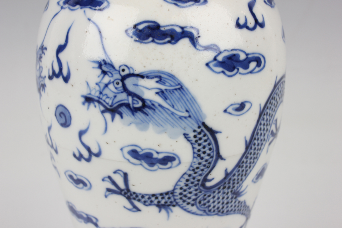 A Chinese blue and white porcelain vase, mark of Kangxi but late 19th century, the baluster body - Image 6 of 10