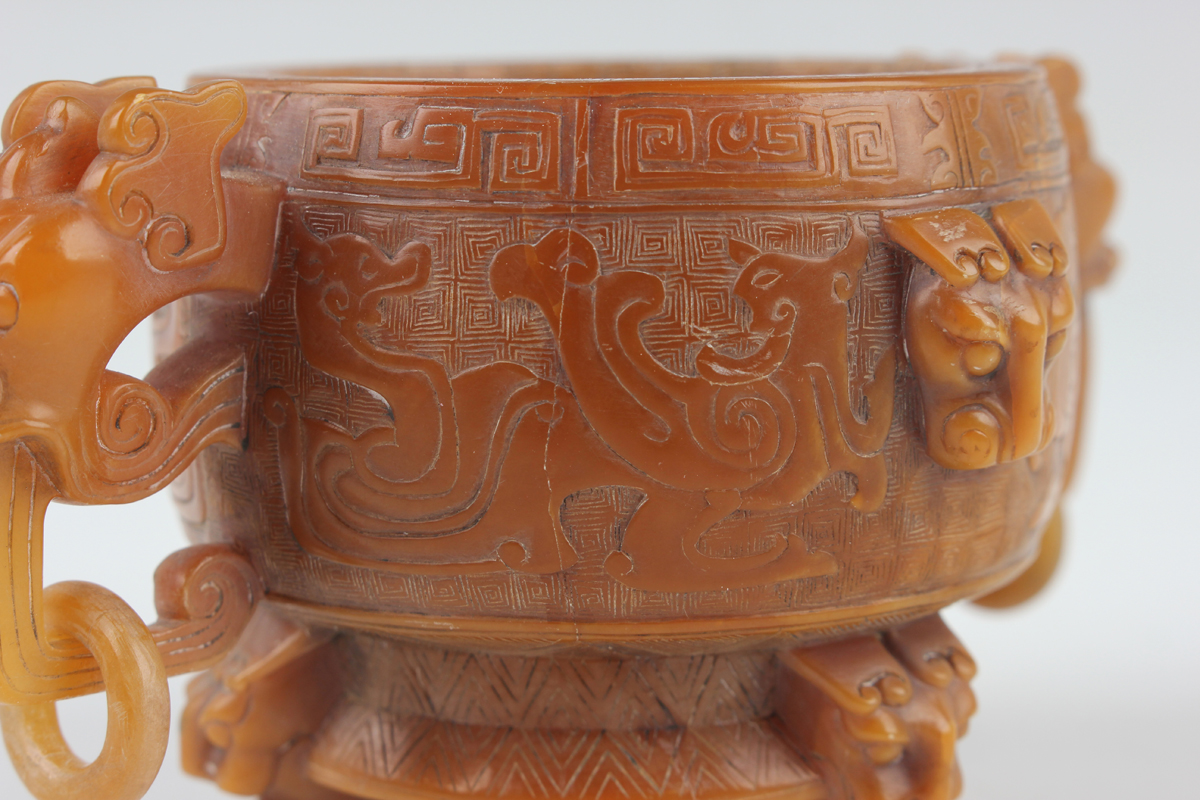 A Chinese archaistic butterscotch coloured soapstone tripod censer and cover, late Qing dynasty, the - Image 12 of 30