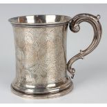 An early Victorian silver christening tankard of tapered cylindrical form with scroll handle,