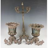 A pair of 19th century plated wine coolers, each of urn form with wavy naturalistic outswept rim