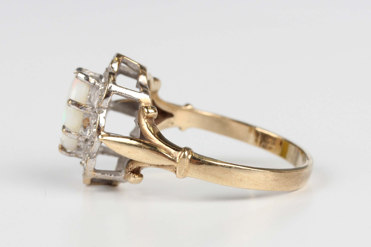 A 9ct gold, opal and diamond shaped oval cluster ring, claw set with the oval opal within a surround - Image 4 of 5