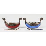 A pair of 20th century Norwegian sterling silver and enamelled longboat salts and spoons, one