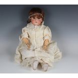 A German bisque head doll, impressed 'C4', with later brown wig, sleeping brown eyes, open mouth