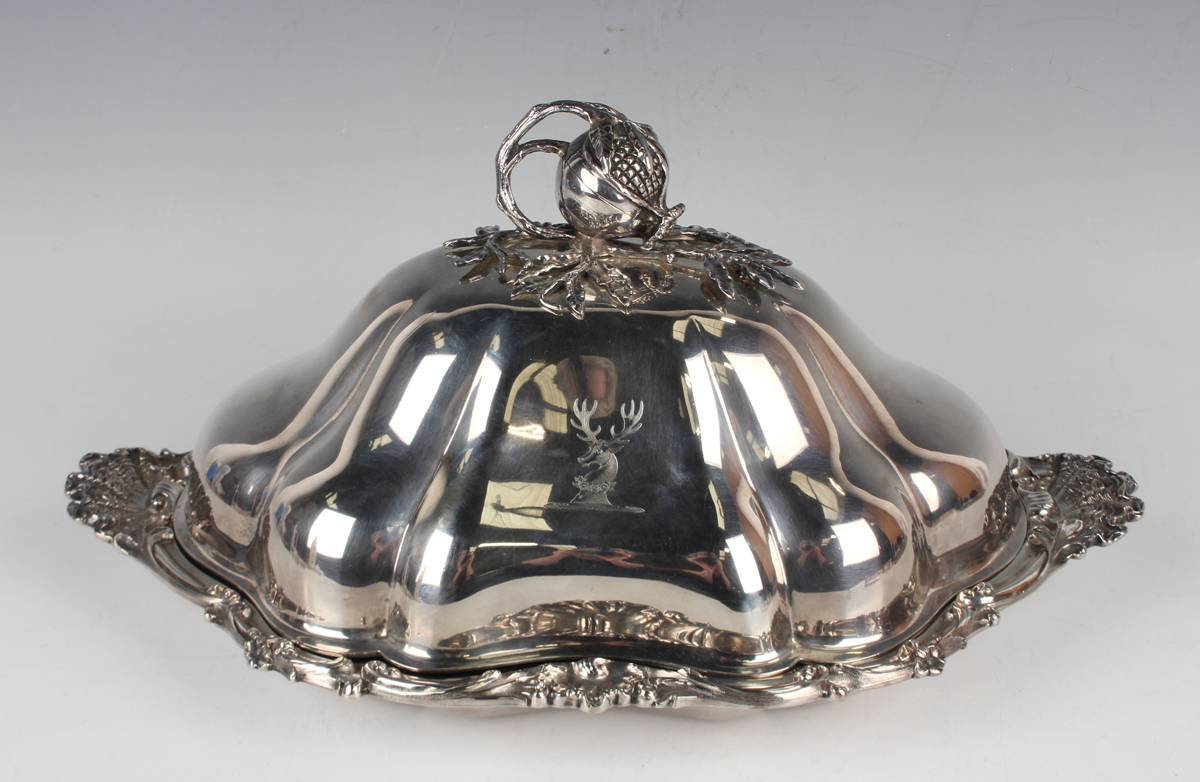 An early Victorian silver entrée dish and cover, the shallow dish with cast foliate scroll,