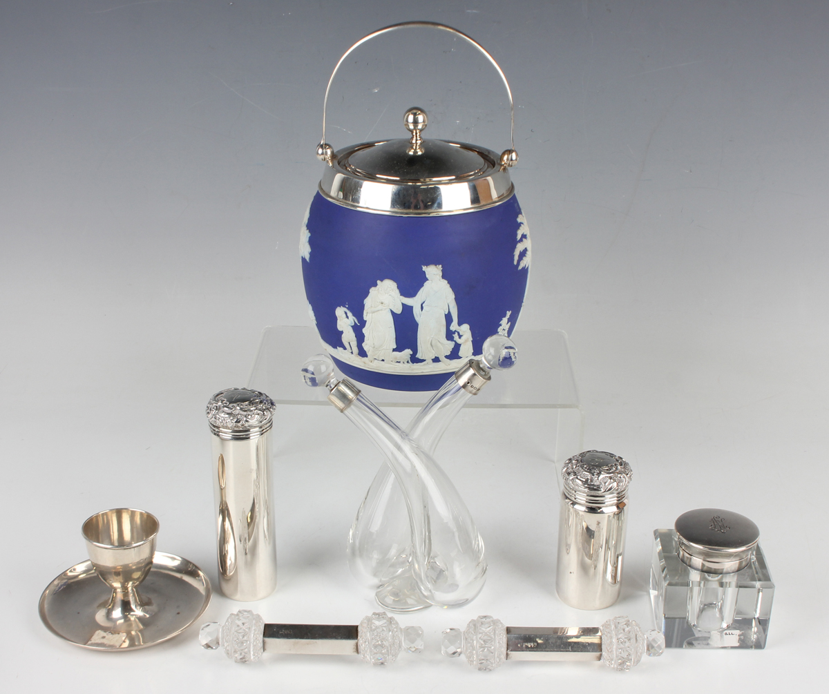 A George V silver mounted Wedgwood blue jasperware biscuit barrel and cover with swing handle,