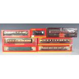 A small collection of Hornby and Hornby Railways gauge OO coaches and goods rolling stock, including