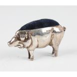 A George V silver novelty pin cushion in the form of a pig, Birmingham 1910 by W.J. Myatt & Co,