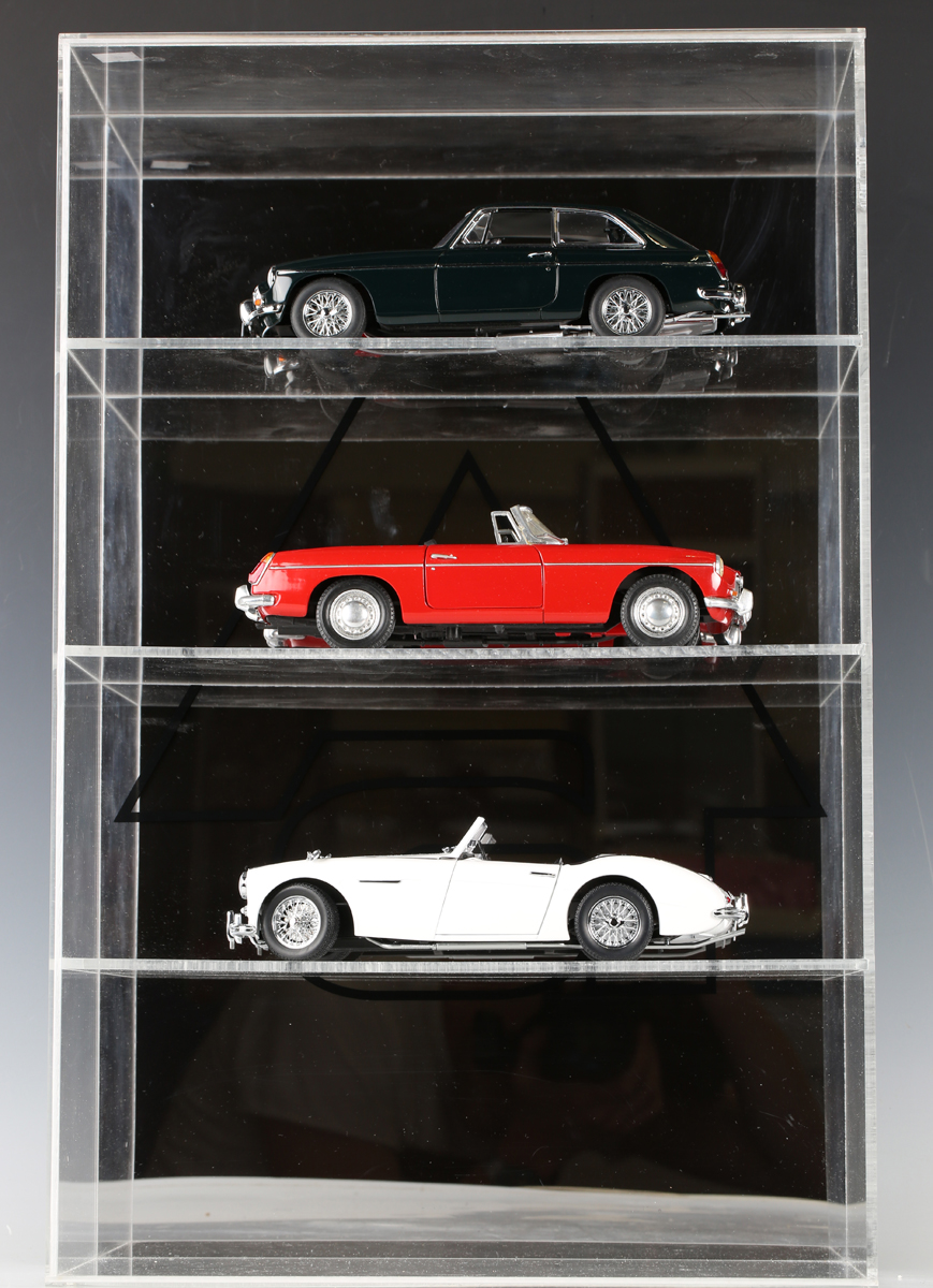 Two AutoArt 1:18 scale model cars, comprising Austin Healey 3000 and MGB GT Coupe MKII, both boxed