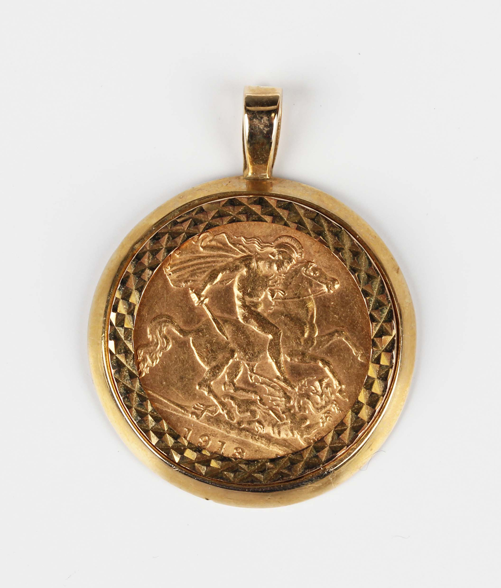 A George V half-sovereign 1913 in a 9ct gold pendant mount, weight 6.3g, length 3cm.Buyer’s