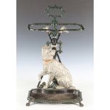 A late Victorian cold painted cast iron stick stand, decorated in relief with a Highland terrier