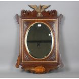 A late 19th century mahogany wall mirror with carved giltwood eagle surmount, 87cm x 60cm.