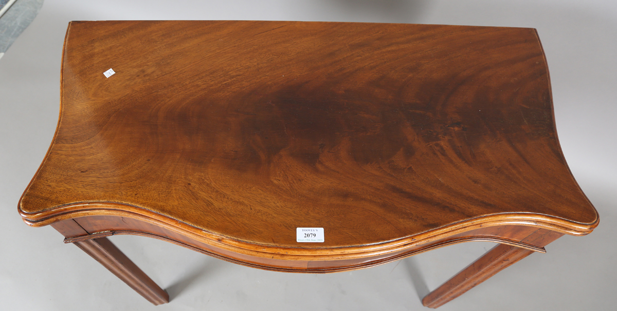 A George III mahogany serpentine front fold-over tea table, height 72cm, width 90cm, depth 44cm. - Image 6 of 6