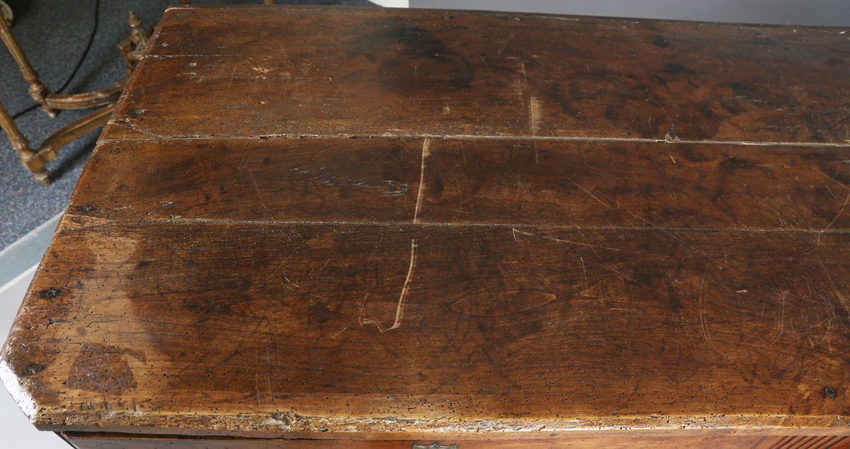 An 18th century French provincial walnut cabinet, fitted with two drawers above panelled doors, - Image 20 of 20