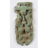 A Viking verdigris bronze strap-end, decorated in relief with anthropomorphic figures, length 5.
