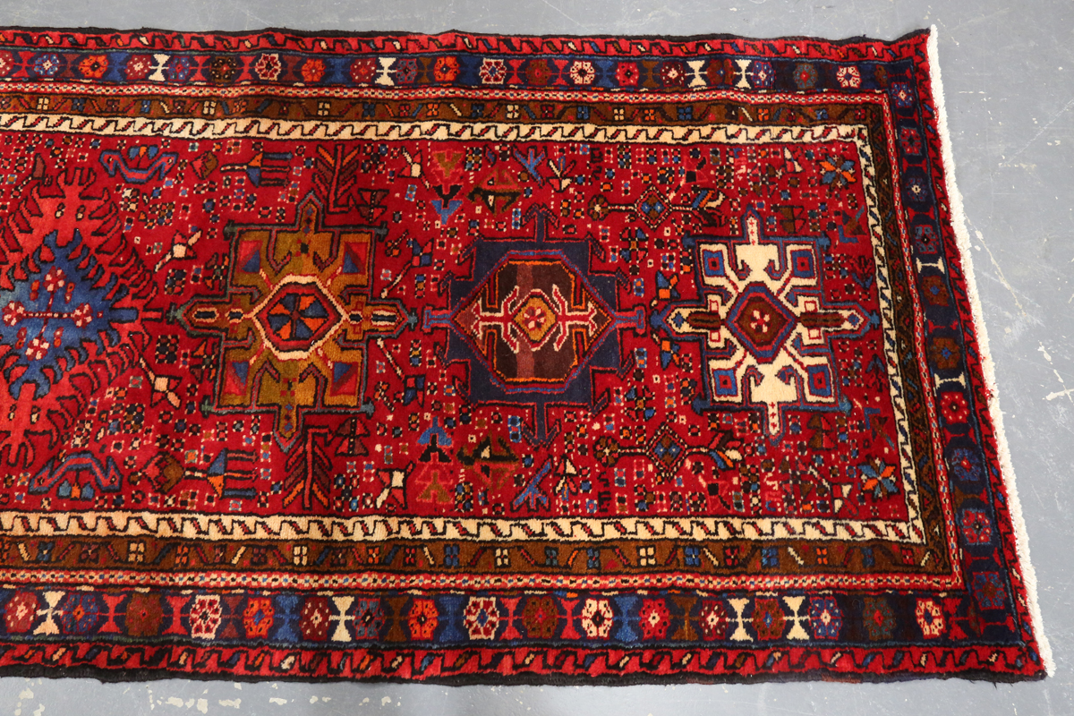 A Heriz runner, North-west Persia, mid/late 20th century, the red field with a column of shaped - Image 3 of 7