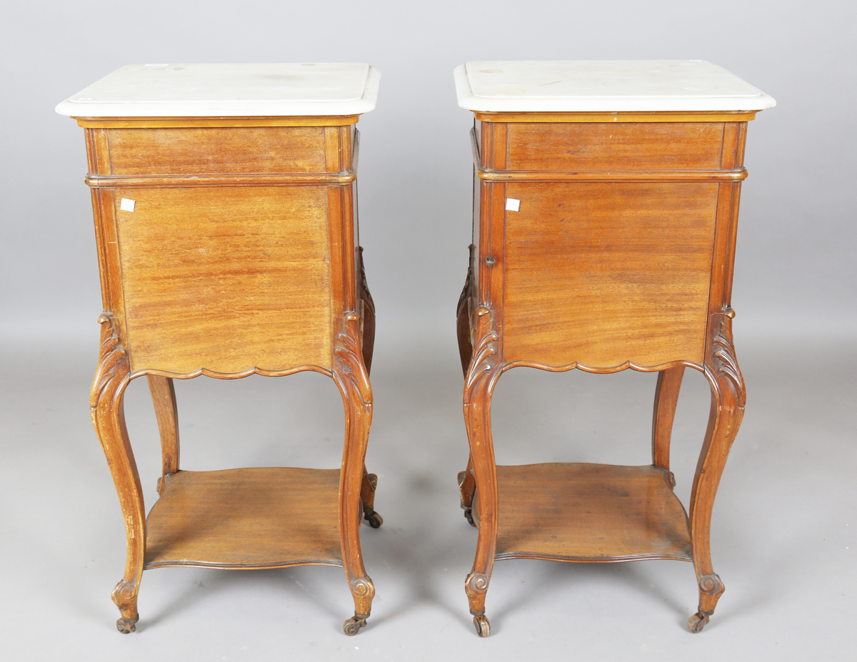 A pair of early 20th century French mahogany and white marble-topped beside cabinets, each fitted - Image 3 of 20