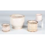 A group of four 18th century Delft tin glazed ointment pots, height of largest 7cm (faults).Buyer’