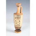 A Greek white ground lekythos, 6th century BC, the tapering ovoid body decorated with a band of