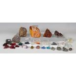 A selection of mineral specimens, including amber, topaz, opal and chalcopyrite on dolomite,