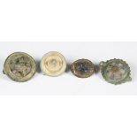 A group of four Romano-British disc type and umbonate brooches, largest diameter 2.6cm. Note: from