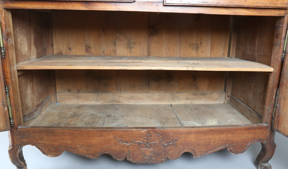 An 18th century French provincial walnut cabinet, fitted with two drawers above panelled doors, - Image 13 of 20