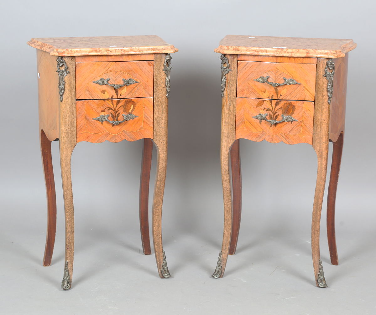 A pair of late 20th century French kingwood bedside chests with inlaid decoration, the marble tops